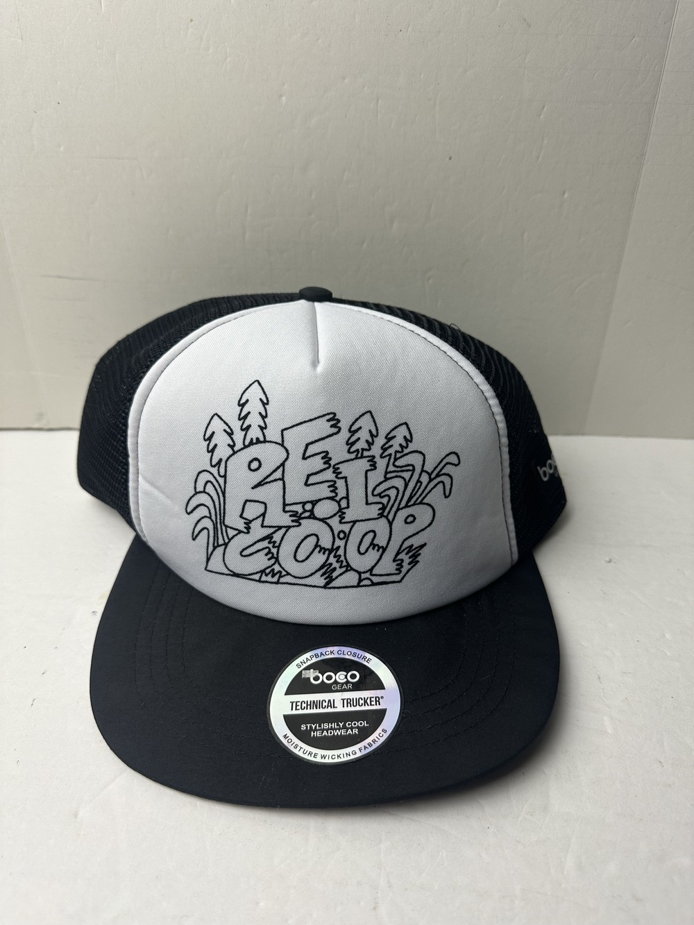 REI mesh back trucker hat with grey front panel and retro doodle graphic